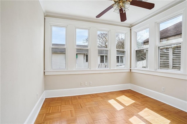 unfurnished sunroom with ceiling fan