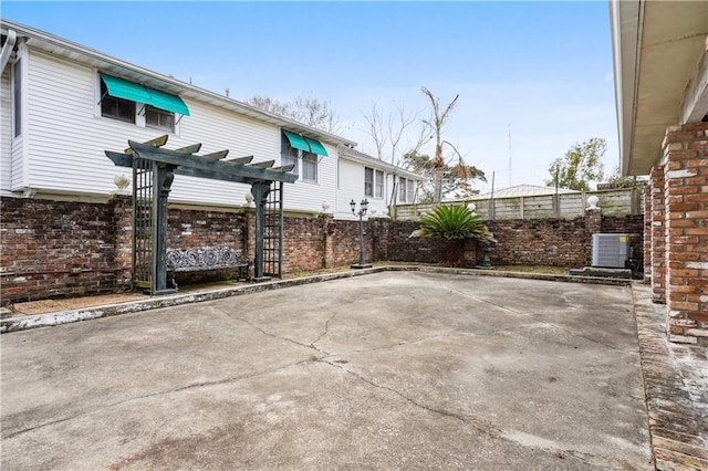 view of patio featuring fence and central air condition unit