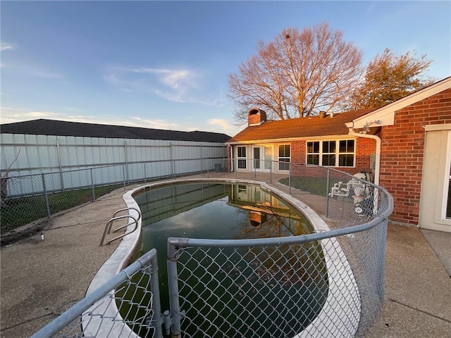 view of pool featuring a fenced backyard and a fenced in pool