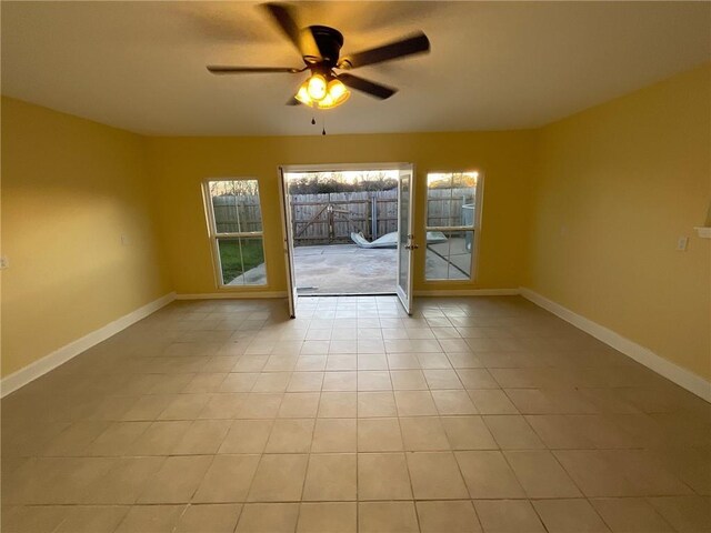 interior space with french doors, visible vents, lofted ceiling with beams, a ceiling fan, and light tile patterned flooring