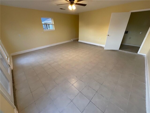 unfurnished living room featuring ceiling fan, visible vents, beam ceiling, and light tile patterned flooring