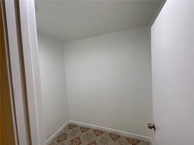 empty room featuring baseboards