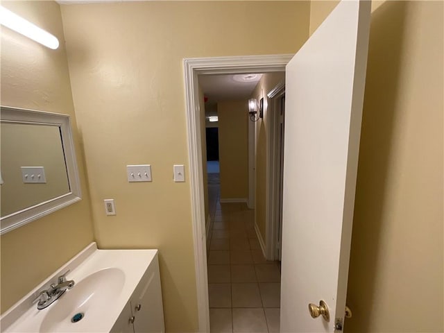 bathroom featuring tile patterned flooring and vanity