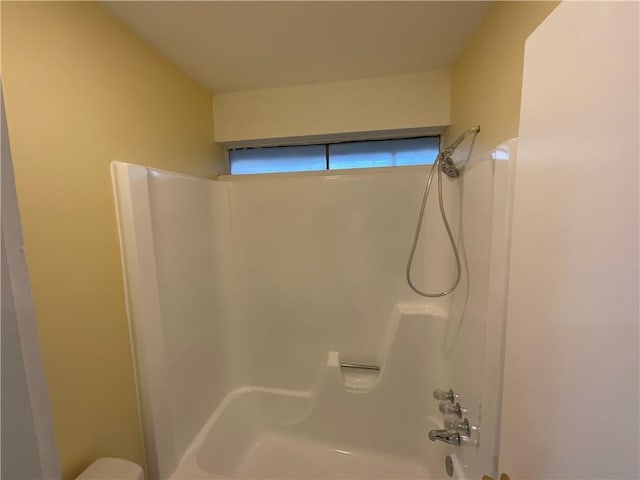 bathroom featuring  shower combination