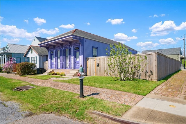 1026 Delaronde St, New Orleans, LA 70114 - view of front of house featuring a front lawn