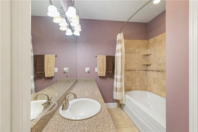 full bathroom featuring shower / bath combination with curtain, an inviting chandelier, vanity, baseboards, and tile patterned floors