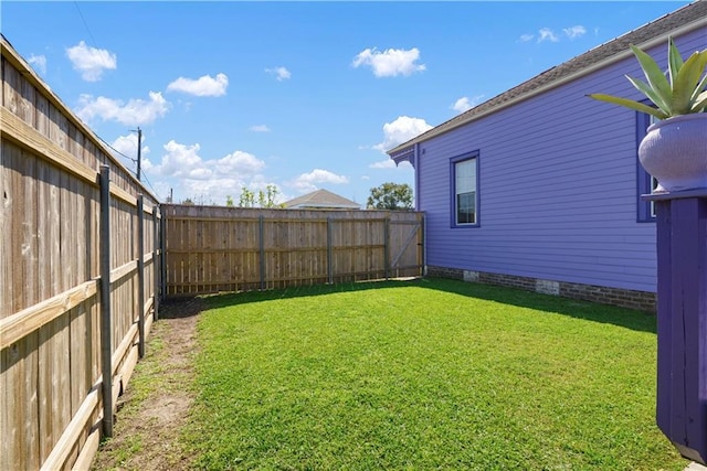 view of yard with a fenced backyard