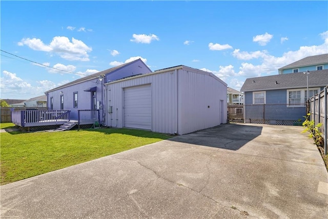 1026 Delaronde St, New Orleans, LA 70114 - exterior space featuring driveway, fence, and a garage