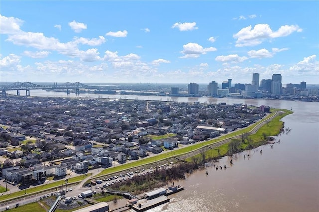 drone / aerial view featuring a water view and a city view