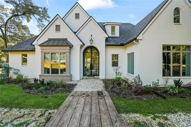 23648 Goodlife Ln, Covington, LA 70435 - french country inspired facade with a shingled roof, brick siding, and a standing seam roof