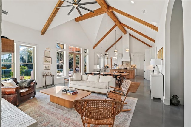 23648 Goodlife Ln, Covington, LA 70435 - living room featuring high vaulted ceiling, beam ceiling, finished concrete flooring, and a ceiling fan