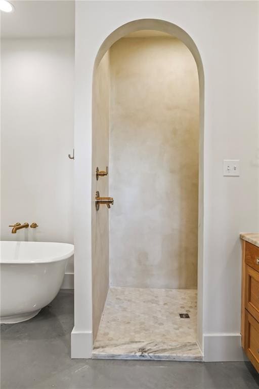 23648 Goodlife Ln, Covington, LA 70435 - bathroom with vanity, concrete flooring, a freestanding bath, and a shower stall