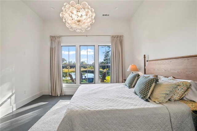 23648 Goodlife Ln, Covington, LA 70435 - bedroom featuring a chandelier and baseboards