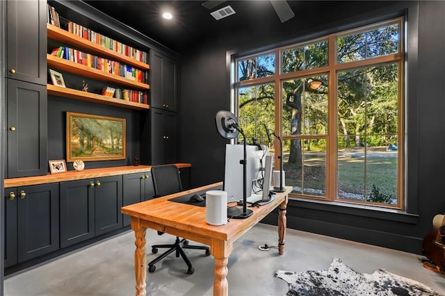 23648 Goodlife Ln, Covington, LA 70435 - office area featuring concrete floors, plenty of natural light, and built in features