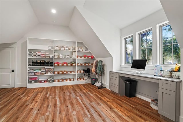 23648 Goodlife Ln, Covington, LA 70435 - office featuring light wood-style flooring, vaulted ceiling, and built in desk