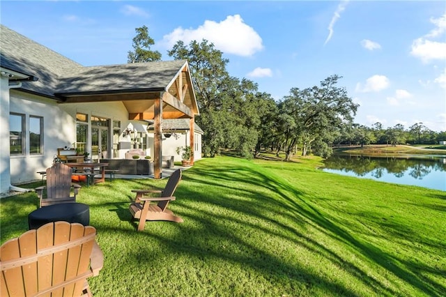 23648 Goodlife Ln, Covington, LA 70435 - view of green lawn with a water view, outdoor lounge area, and a patio area