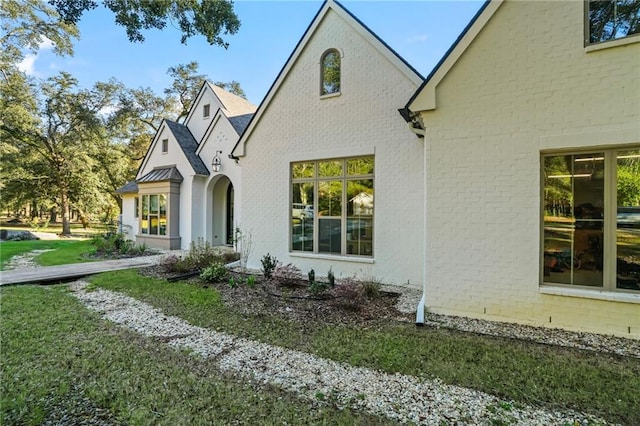 23648 Goodlife Ln, Covington, LA 70435 - view of side of property featuring brick siding and a lawn