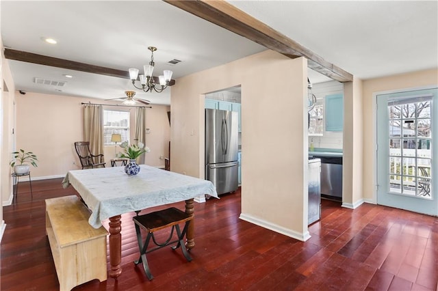 dining area featuring dark wood-style flooring, visible vents, a notable chandelier, and beamed ceiling