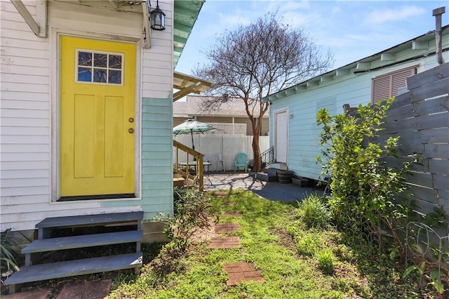 property entrance featuring fence