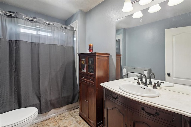 full bath with shower / bath combination with curtain, vanity, and toilet