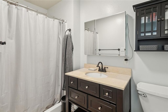 full bath with toilet and vanity