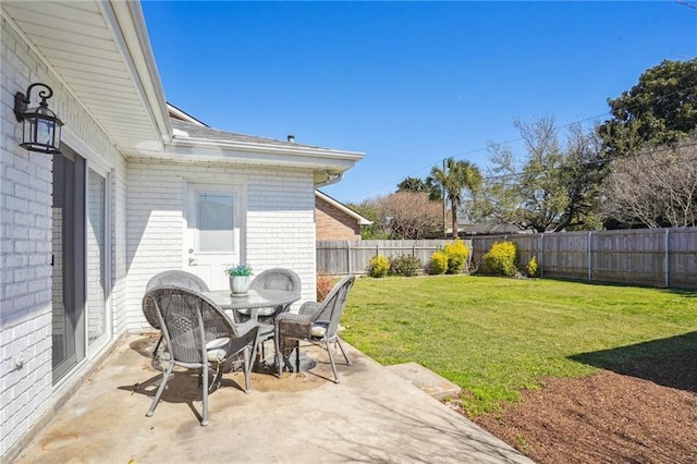 view of patio / terrace featuring a fenced backyard and outdoor dining area