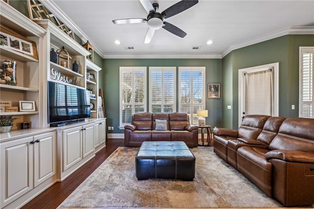 living area featuring visible vents, a ceiling fan, dark wood-style floors, and crown molding