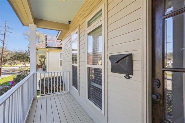 balcony featuring a porch