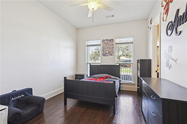 bedroom with visible vents, baseboards, ceiling fan, and dark wood-style flooring