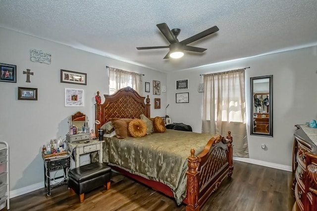 bedroom featuring a textured ceiling, ceiling fan, wood finished floors, and baseboards