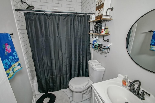 bathroom with vanity, toilet, and shower / bath combo with shower curtain