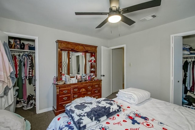 bedroom with a spacious closet, a closet, carpet, and visible vents