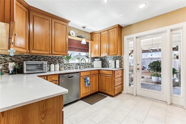 2243 E Canterbury Dr, La Place, LA 70068 - kitchen featuring dishwasher, brown cabinets, and a toaster