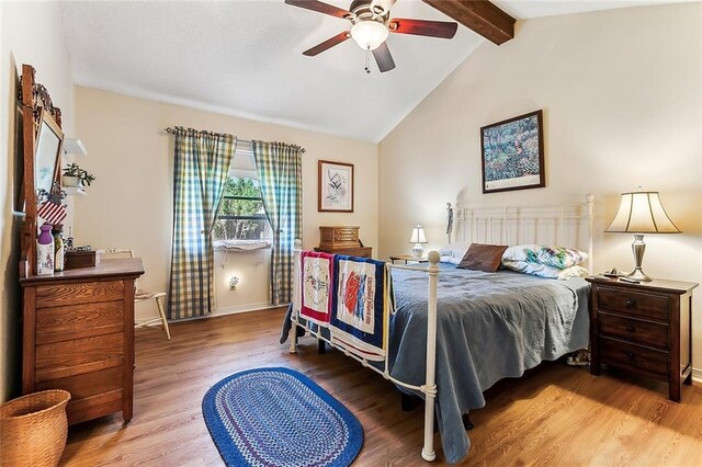 2243 E Canterbury Dr, La Place, LA 70068 - bedroom with lofted ceiling with beams, ceiling fan, wood finished floors, and baseboards