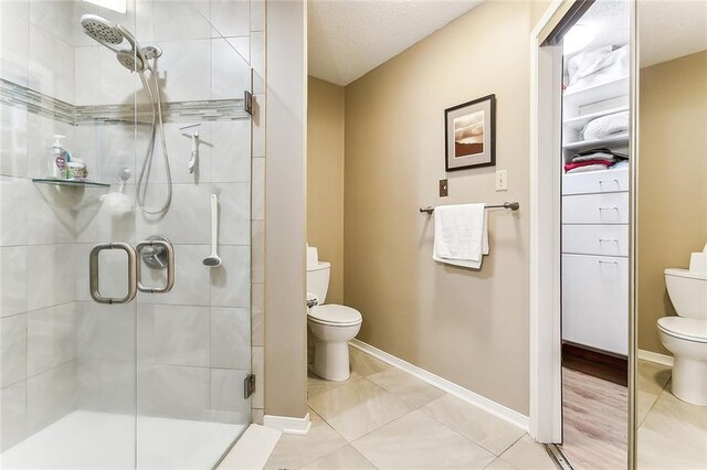 2243 E Canterbury Dr, La Place, LA 70068 - full bath with toilet, a stall shower, and baseboards