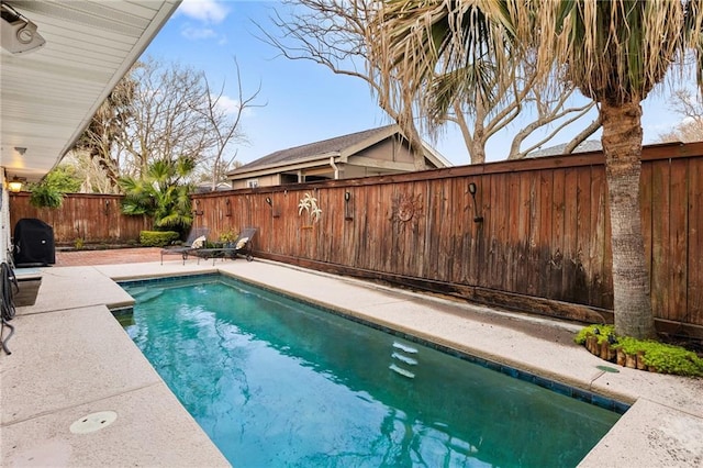 view of swimming pool featuring a fenced backyard, a fenced in pool, and a patio