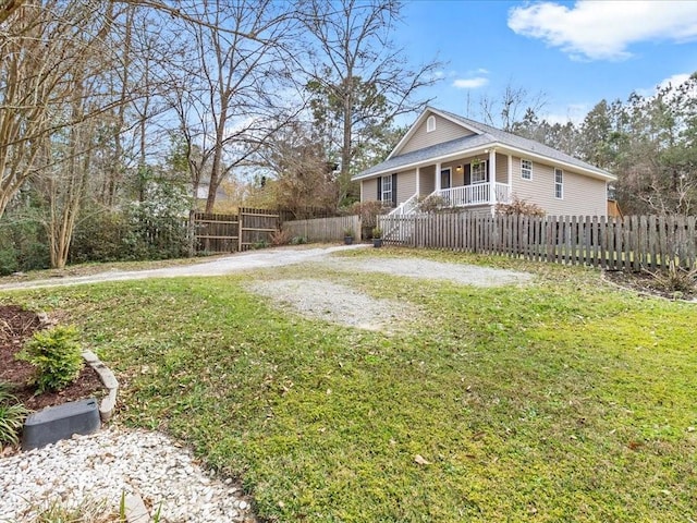 view of yard featuring a fenced front yard and driveway