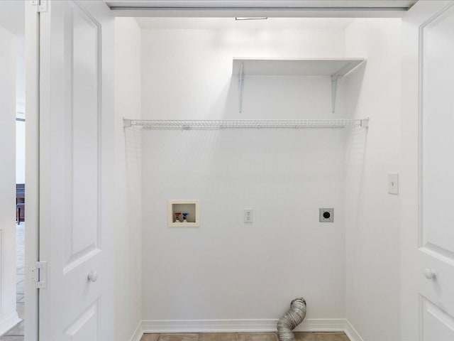 laundry room featuring hookup for a washing machine, laundry area, electric dryer hookup, and baseboards