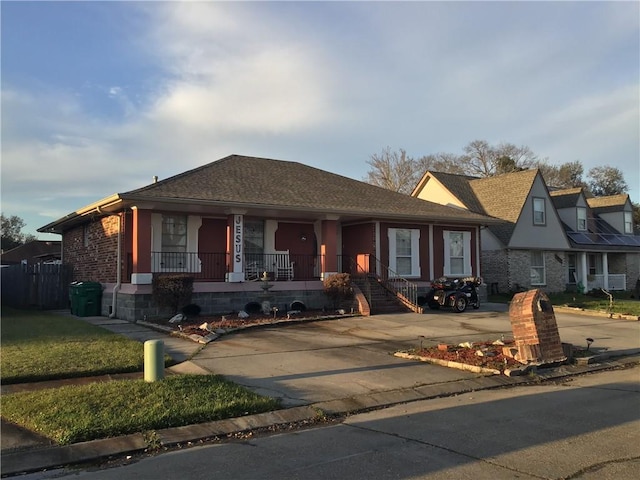 view of front of property featuring a porch and brick siding