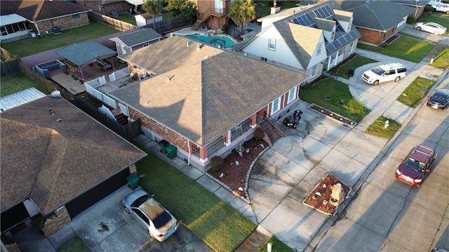 birds eye view of property with a residential view