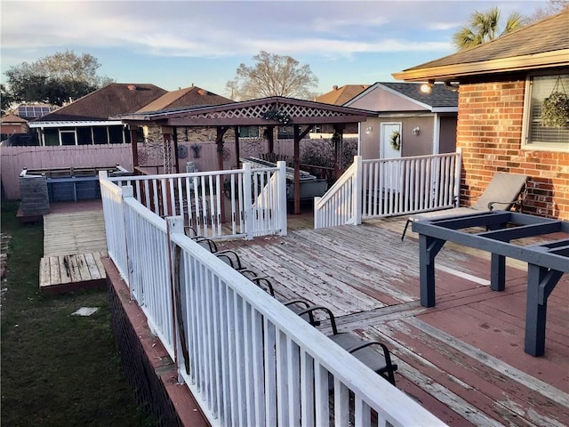 wooden deck featuring a fenced backyard