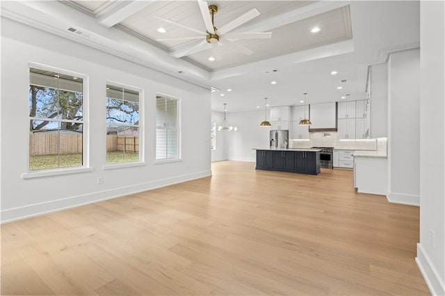 unfurnished living room featuring a chandelier, recessed lighting, visible vents, baseboards, and light wood finished floors