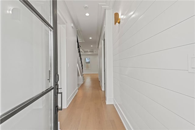 hall featuring recessed lighting, baseboards, and light wood finished floors