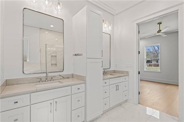 bathroom featuring vanity, baseboards, a ceiling fan, marble finish floor, and walk in shower