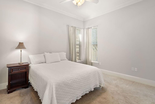 bedroom featuring ornamental molding, carpet flooring, ceiling fan, and baseboards