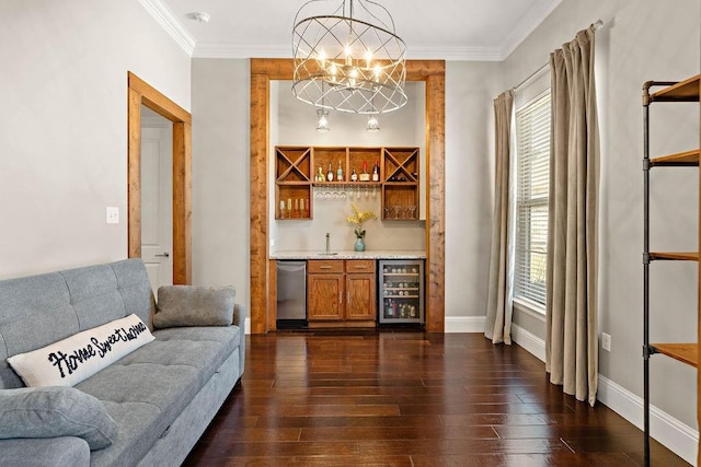 bar with wine cooler, dark wood-type flooring, wet bar, crown molding, and a notable chandelier