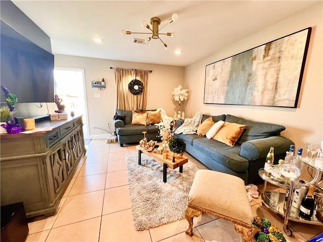 living area featuring light tile patterned floors, baseboards, visible vents, and recessed lighting