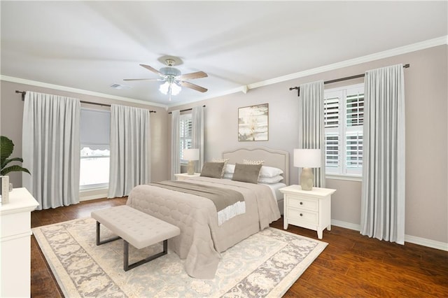 bedroom featuring multiple windows, crown molding, and wood finished floors