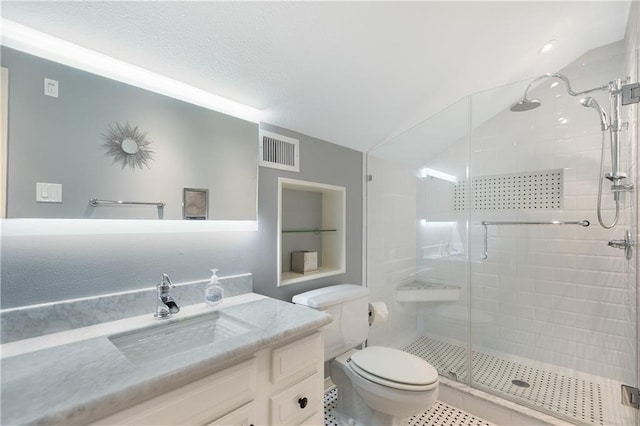 full bath with toilet, vanity, visible vents, tile patterned floors, and a stall shower