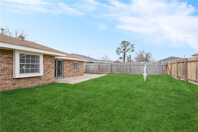 view of yard featuring a patio and a fenced backyard